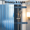 A close-up of a translucent blue 3D pattern shower curtain liner allowing light through.