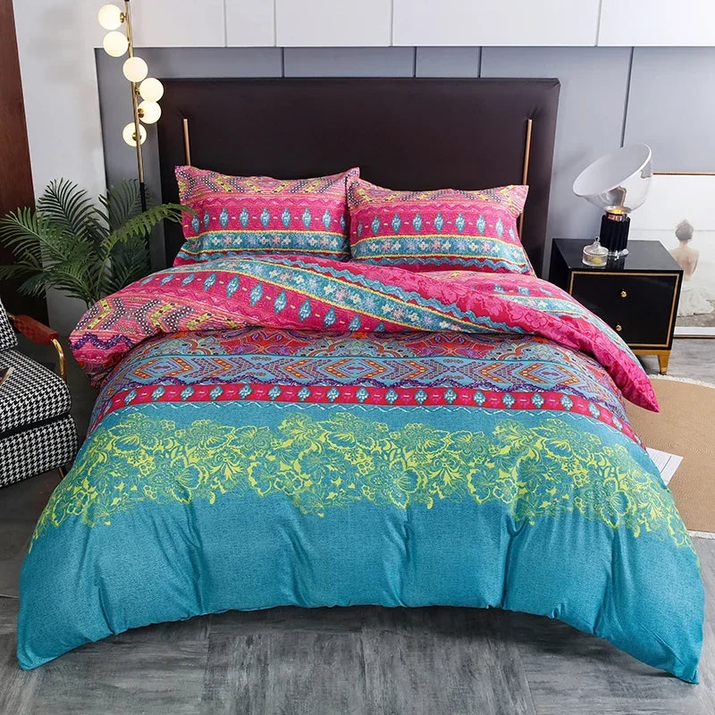 A teal and pink geometric duvet cover set with patterned pillows displayed on a bed.