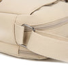 A close-up view of a beige nylon crossbody bag with a silver zipper and strap detail.