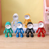 A collection of bendable robot night lights in various colors including white, yellow, blue, black, and red.