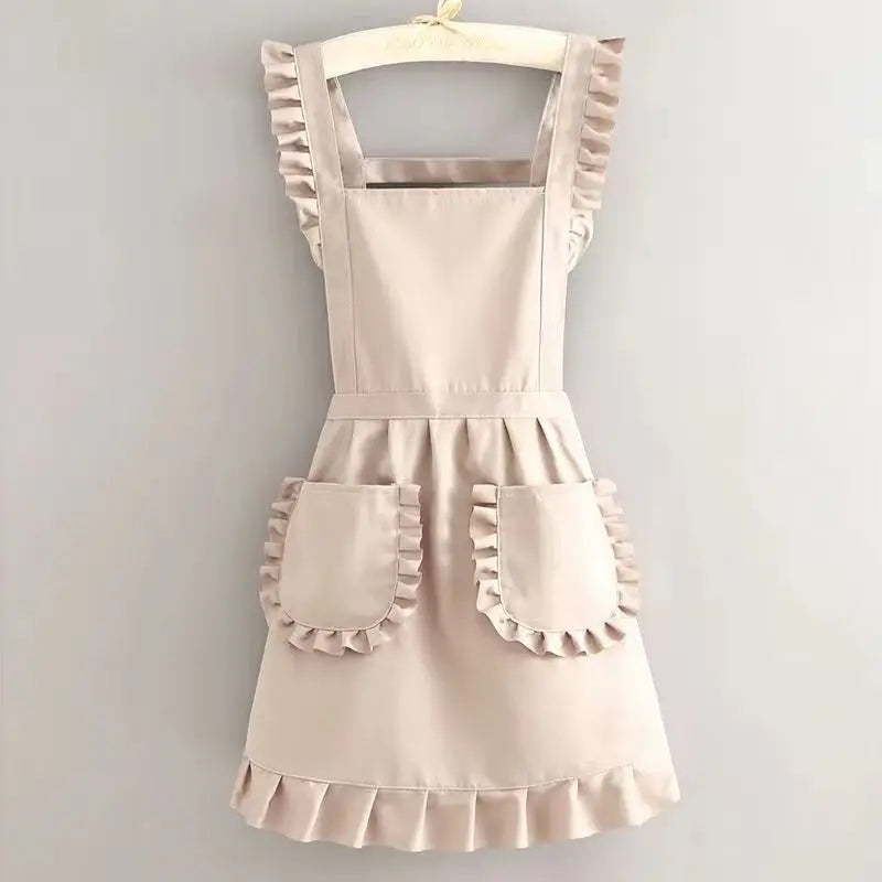 A light beige Korean style cotton kitchen apron with adjustable neck straps and ruffled details.