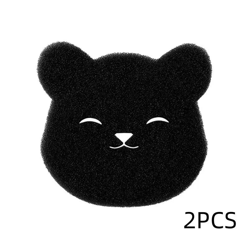 Une paire de tampons à poils noirs en forme de chat pour retirer les poils d'animaux.