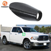 Carbon fiber antenna base cover for a white Dodge RAM 1500 pickup truck.