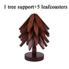 A wooden tree design coaster set featuring one tree support and five leaf coasters.