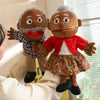 A soft plush full-body hand puppet resembling an elderly man with gray hair and a beard, wearing a plaid shirt and a patterne