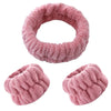 Two pink microfiber wrist sweatbands and scrunchies for face washing