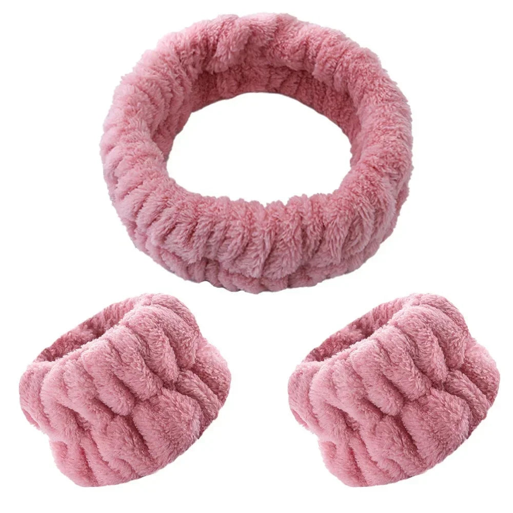 Two pink microfiber wrist sweatbands and scrunchies for face washing