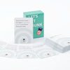 A box of Let's Get Drunk drinking cards and several individual cards are displayed on a white surface.