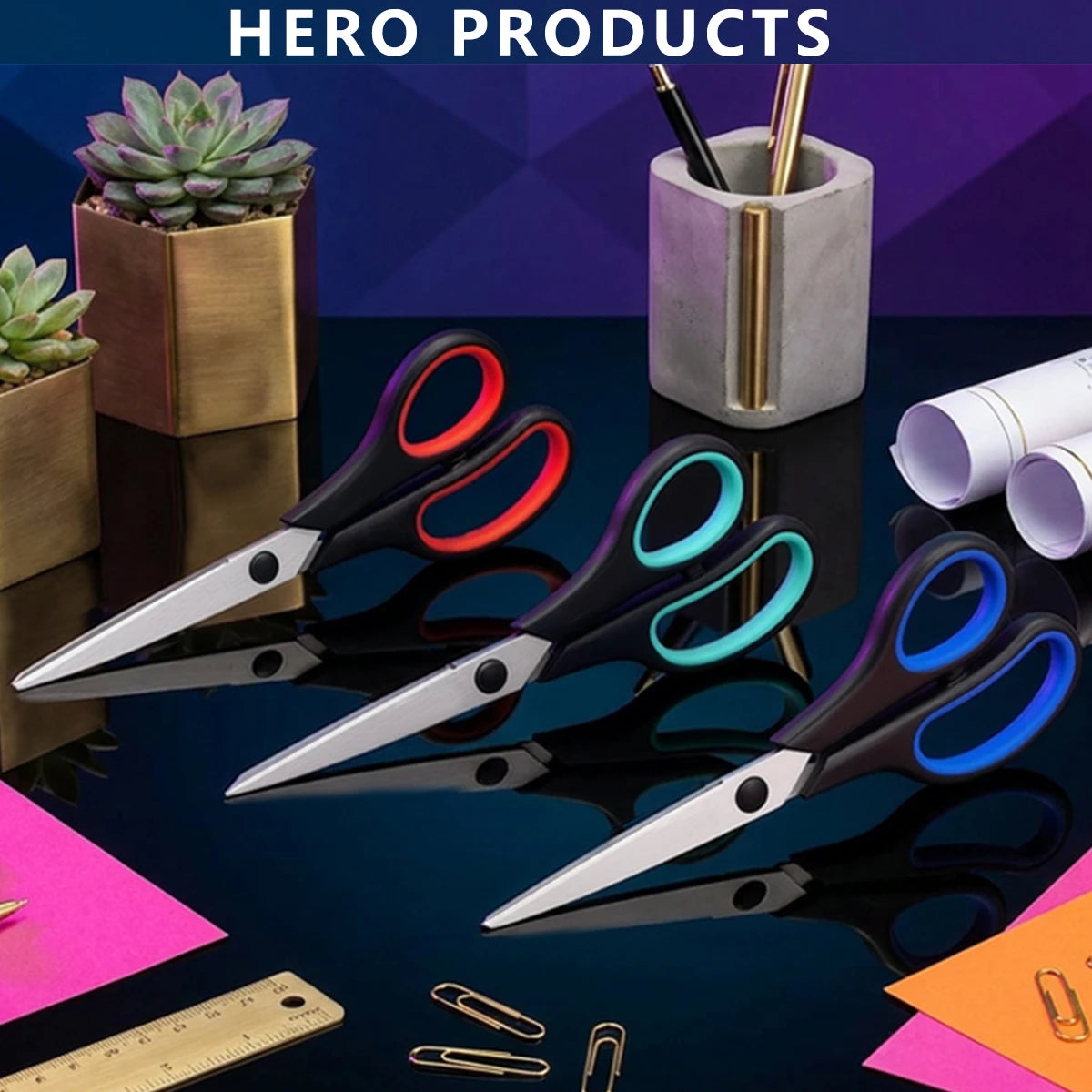A collection of black and colored stainless steel scissors, rulers, and succulent plants displayed on a dark surface.