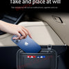 A hand places a blue Apple phone into a black universal car seat side pocket organizer for storage.