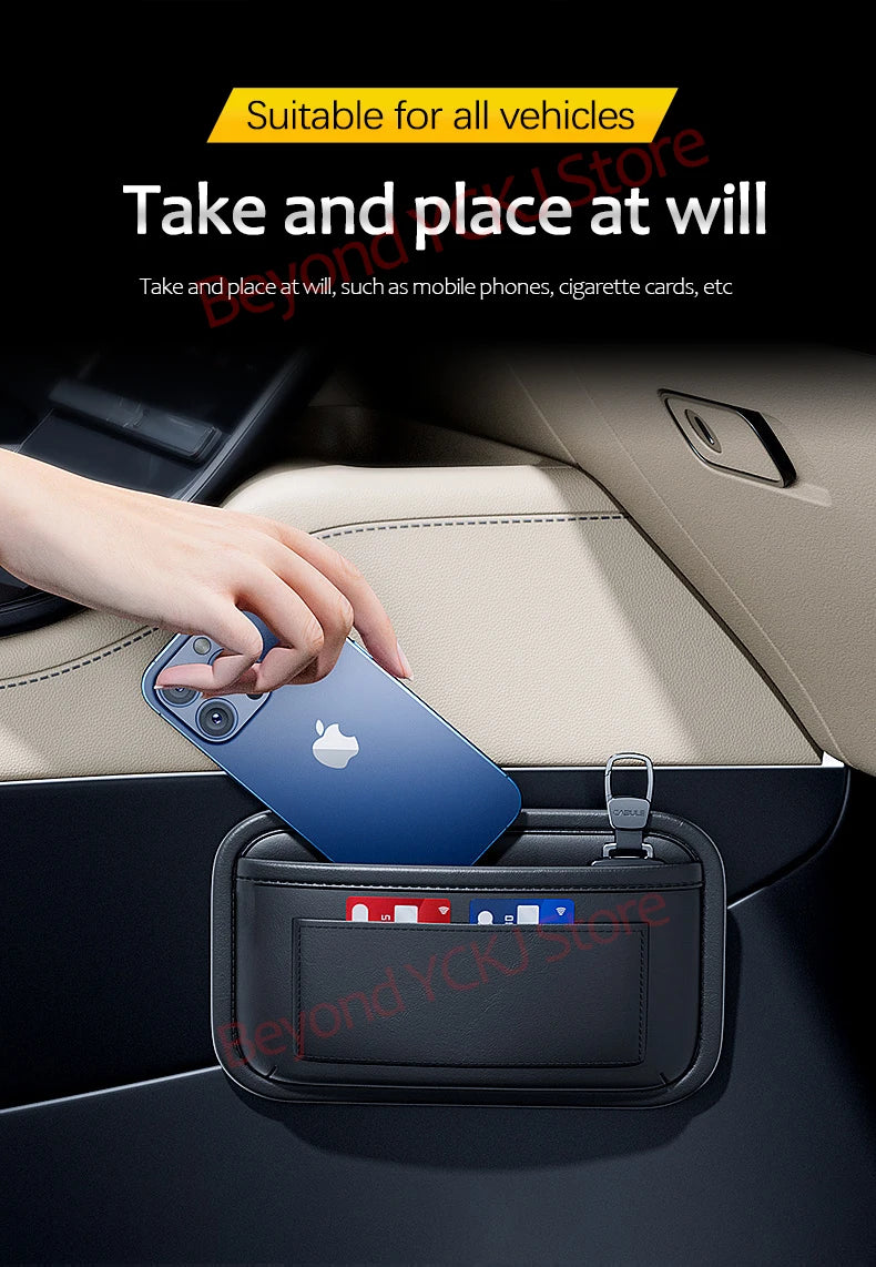 A hand places a blue Apple phone into a black universal car seat side pocket organizer for storage.