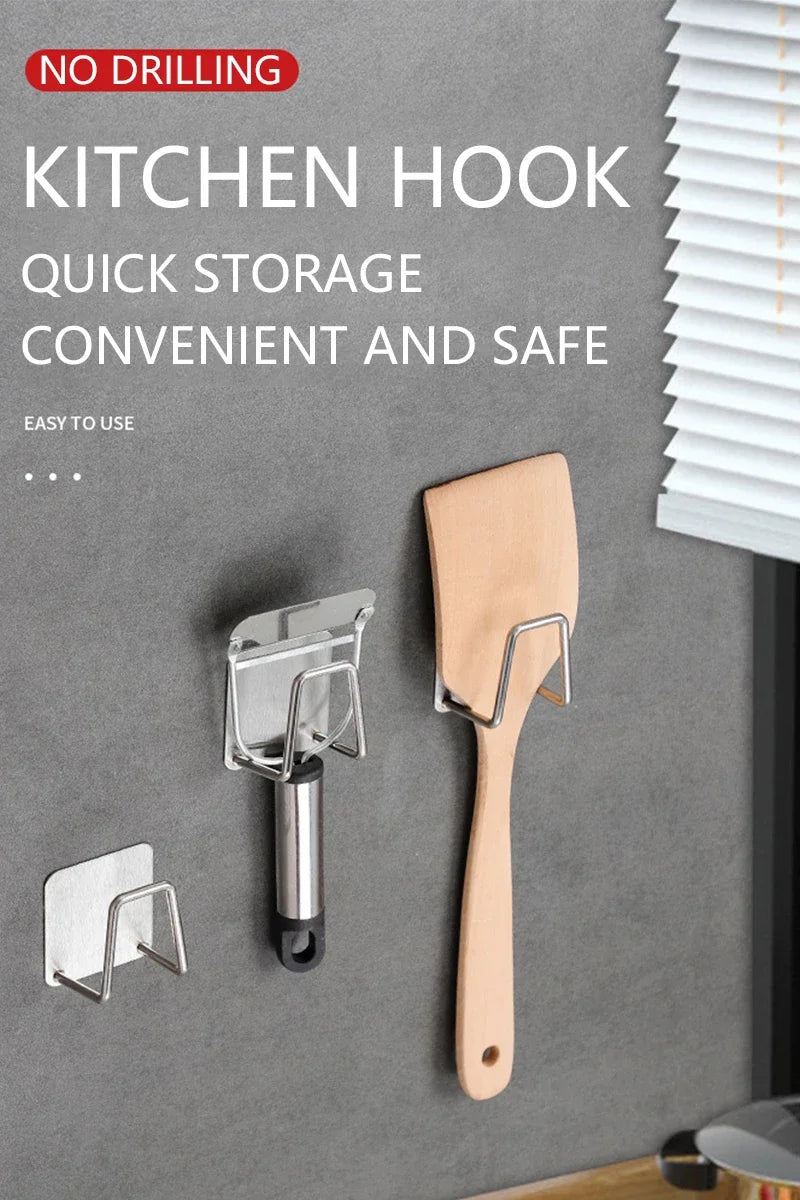 A stainless steel kitchen hook is shown mounted on a gray wall, featuring a handle and a sponge holder.