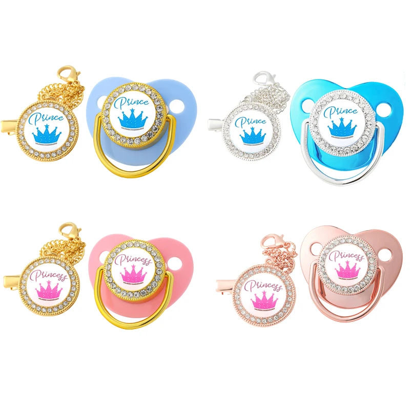 A set of five crystal rhinestone pacifier chain clips with silicone nipples in various colors including gold, blue, and pink.