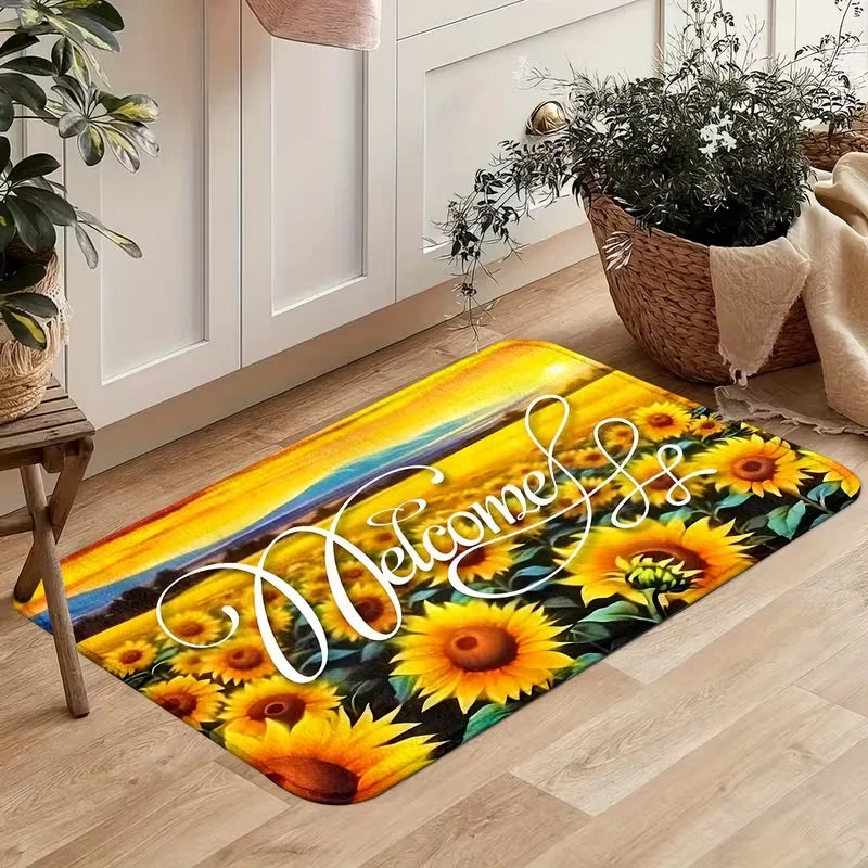A bright yellow and orange sunflower patterned non-slip mat lying on a light wood floor.