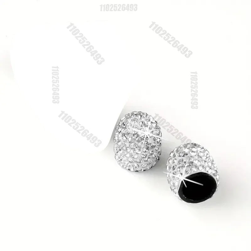 Set aus Kristall-Diamant-Radventilkappen mit schwarzen Einsätzen.