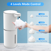 A white touchless automatic soap dispenser is shown with a hand squeezing foam, demonstrating four levels of adjustable foami