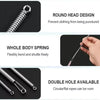 A close-up view of a spring drawstring needle threader tool showing its round head design, whole body spring, and double hole