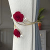 Elegant rose pattern curtain tiebacks featuring red roses and pearl accents on a gold-toned metal design