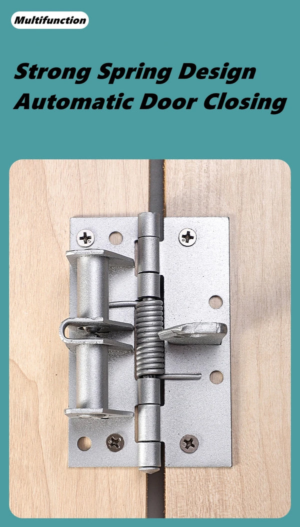 A close-up of a silver spring hinge mechanism installed on a wooden cabinet door.