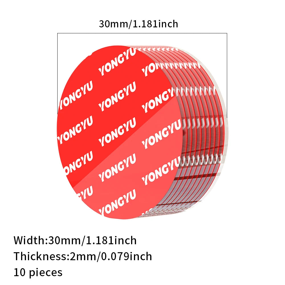 A circular red adhesive pad with text printed on it, shown next to a measurement scale.