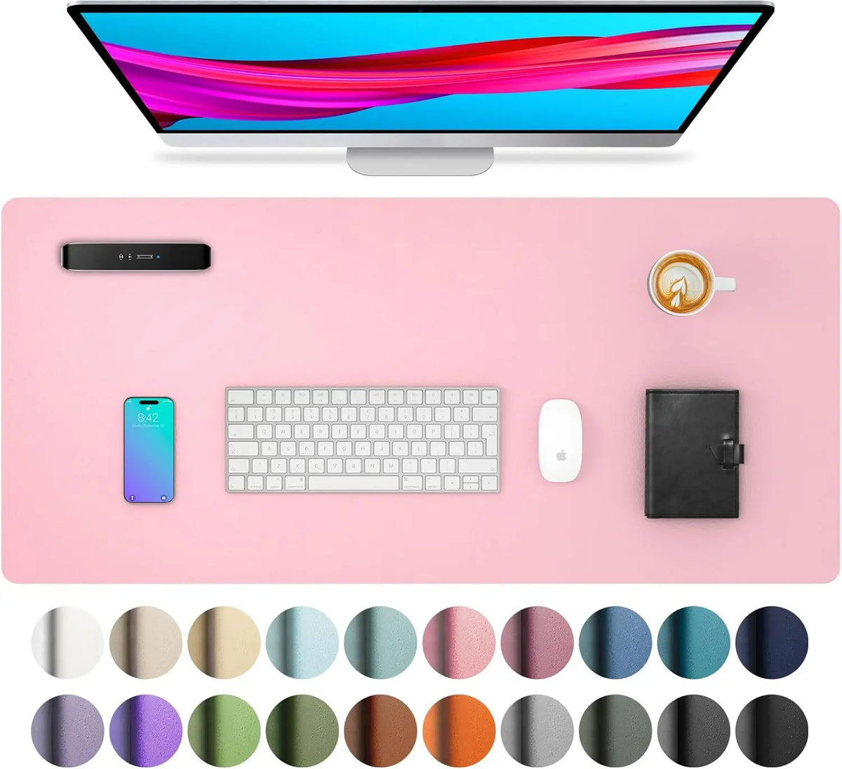A pink desk pad featuring a computer monitor, keyboard, mouse, and various colored circles.