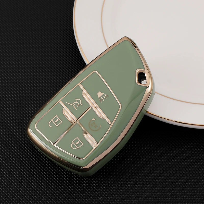 A light green durable TPU car key fob cover resting on a white plate.