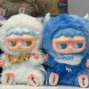 A fluffy white MONBOO collectible blind box featuring a cute face and blue accents.