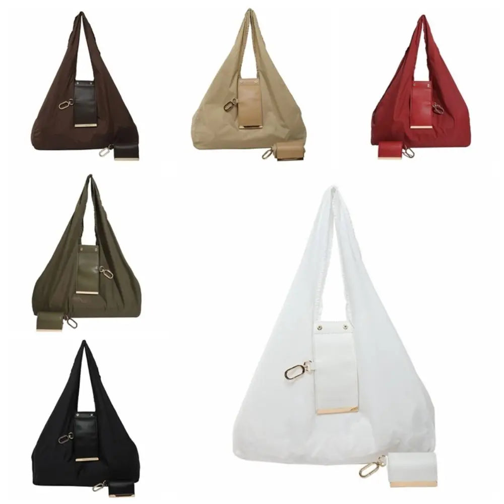 A collection of folding retractable keychain tote bags in brown, beige, red, olive green, and black.