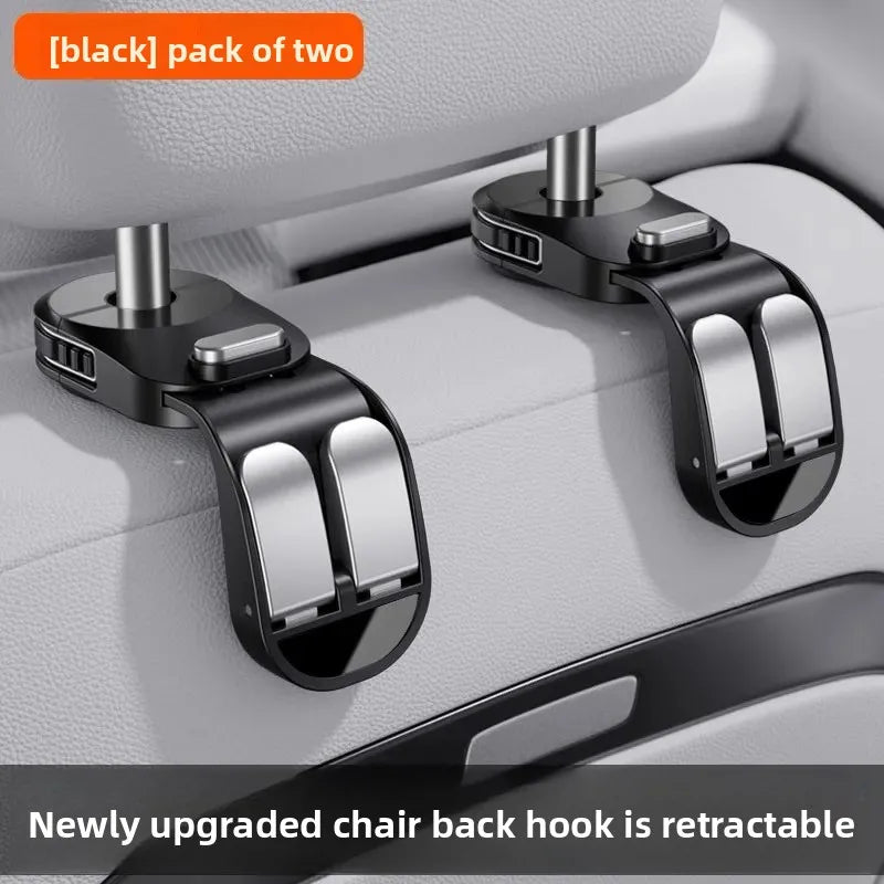 A black pack of two retractable chair back hooks designed for hidden storage in a car seat.