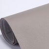 Roll of beige self-adhesive PU leather repair patches, showing the texture and roll form.