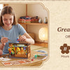 Two women assembling a vintage Japanese corner shop DIY book nook kit with an LED light for a great family activity.