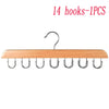 A wooden hanging organizer with 14 hooks for storing belts, hats, and accessories.