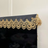 Black table runner featuring gold embroidered mesh lace trim and pendants