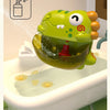 A green dinosaur bubble machine is shown dispensing water and shower gel into a bathtub.