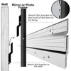 Diagram showing how to attach a mirror or photo frame bracket to a wall using hanging strips.