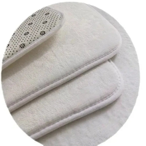 A white soft floral non-slip runner mat with a patterned edge is shown rolled up.