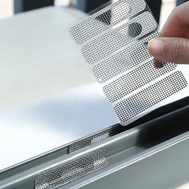 A hand applies a self-adhesive window screen repair patch to a window frame.