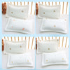 White quilted baby pillows with gold embroidered stars and hearts shown in various sizes