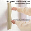 A person is firmly adsorbing a one-piece full suction cup onto a white surface.