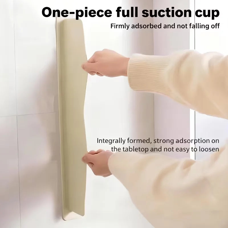 A person is firmly adsorbing a one-piece full suction cup onto a white surface.