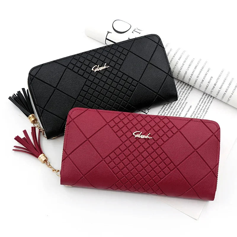 A deep red quilted PU leather wristlet clutch wallet with a black phone pocket and gold chain detail.