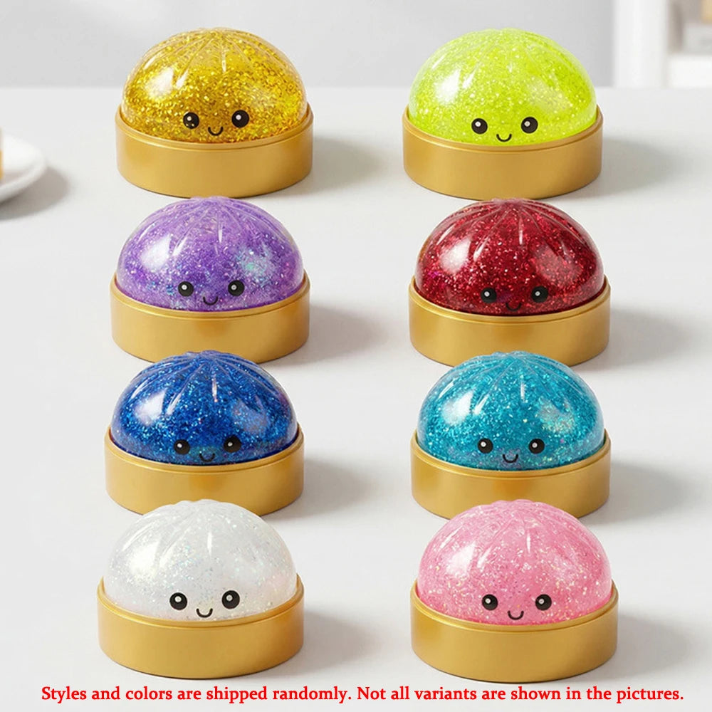 A collection of eight glitter dome squeeze toys in various colors including gold, lime green, purple, red, blue, silver, and 