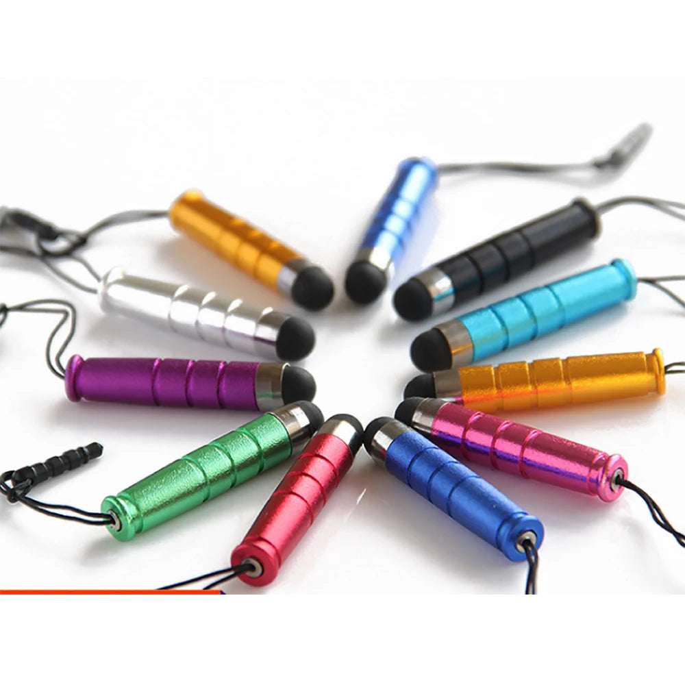 A collection of six fine point stylus pens in various colors including gold, blue, black, and pink, laid out on a white backg