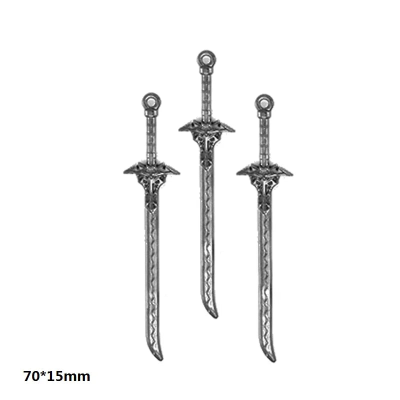 A set of three gun-shaped charms for DIY jewelry making in silver metal.