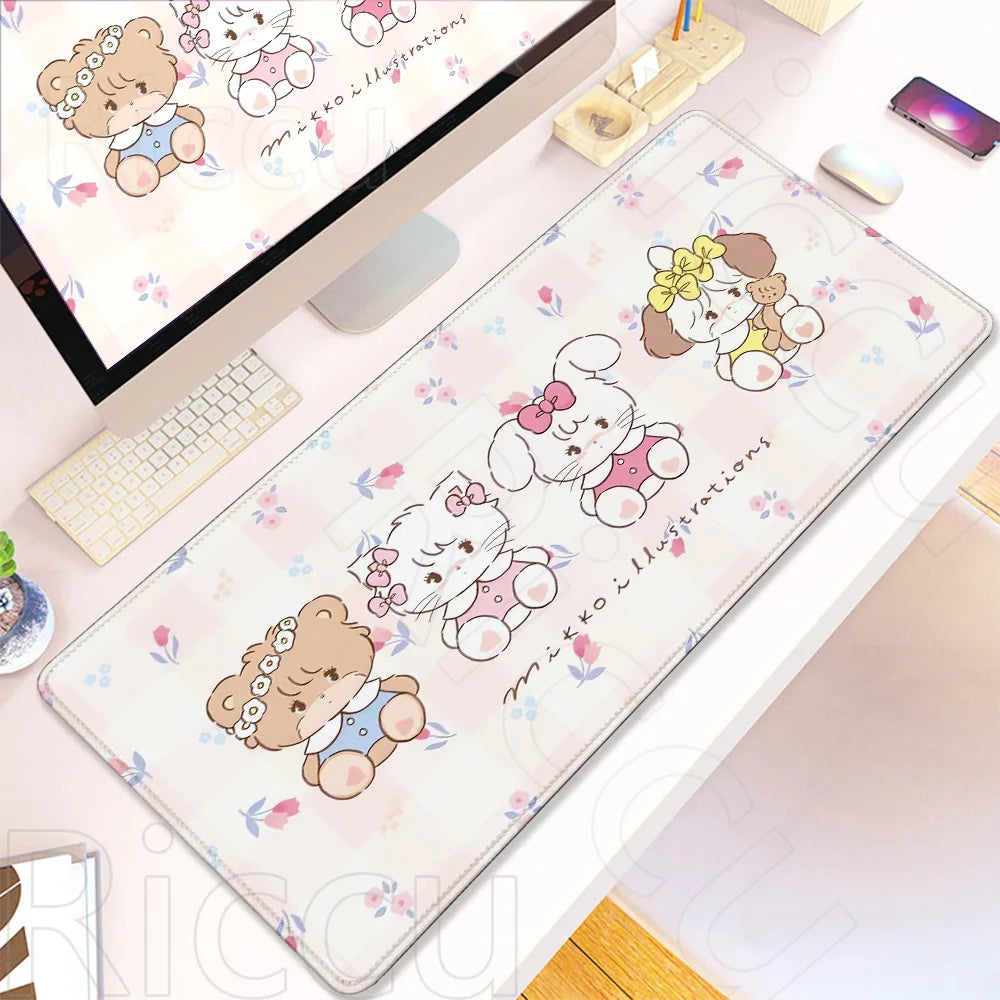 A pink and white kawaii cartoon illustration desk mat featuring cute bear and cat characters with a non-slip rubber base.