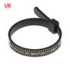 Black ring sizer measuring tool with a magnifier and adjustable ring.