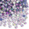 A close-up view of various iridescent and holographic rhinestones in purple, silver, and pink shades.