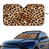 Leopard print car windshield sunshade placed on a blue car windshield.