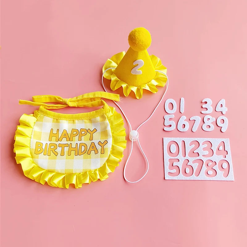 A yellow pet birthday party hat and bib set featuring a yellow sun shape and a checkered fabric.