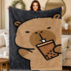 A cartoon bear design on a dark gray flannel throw blanket, holding a coffee cup.
